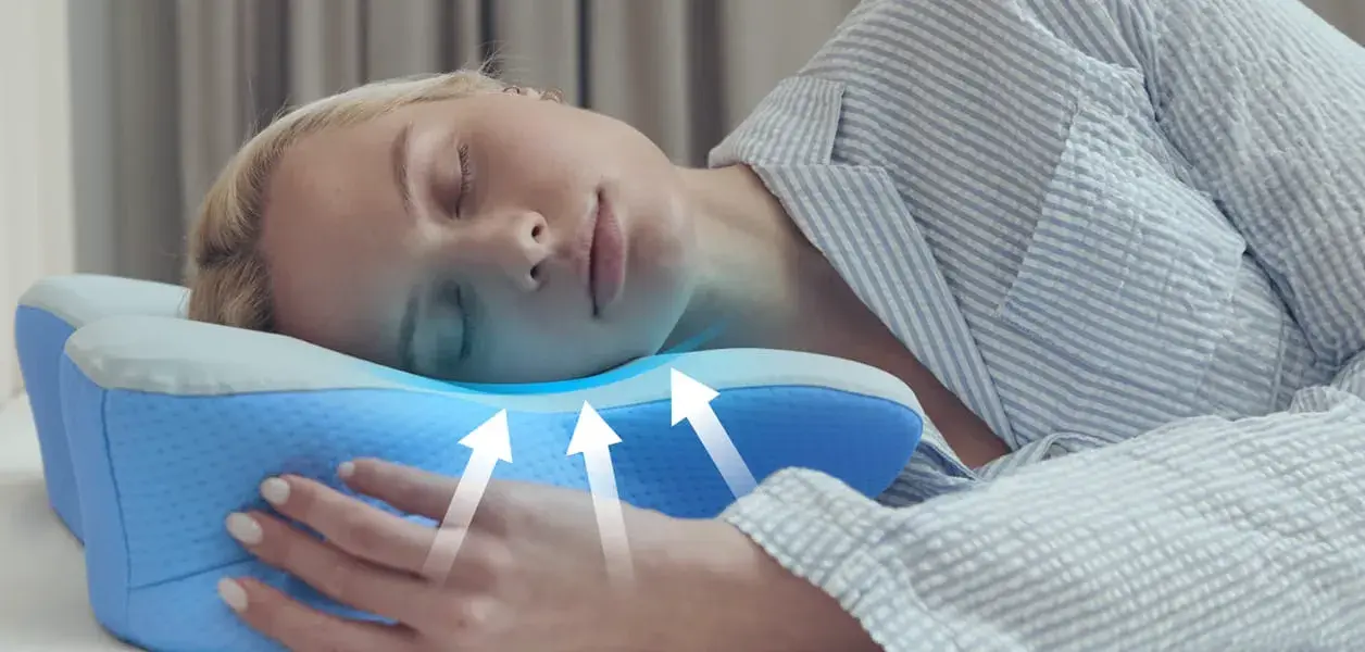 Woman sleeping on Derila Ergo Pillow — front view showing neck support